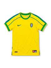 Brazil 1998 yellow home jersey featuring green collar and sleeve trim, Nike Swoosh, and CBF crest with four stars, front view.