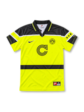 Borussia Dortmund 1996/97 Champions League home jersey in neon yellow with black shoulder panels, Nike logo, BVB 09 crest, and Continentale sponsor, front view.
