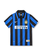 Inter Milan 2007/08 home jersey with blue and black stripes, white Nike Swoosh, Pirelli sponsor and gold 100th anniversary club crest.