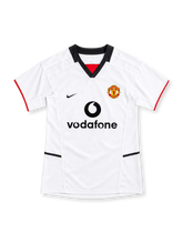 Manchester United 2002/03 white away jersey with black V-neck collar, red sleeve trim, Nike Swoosh, club crest and Vodafone sponsor.