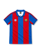 Barcelona 1980–82 home jersey with red and blue vertical stripes, blue collar, checkerboard shoulder trim, Meyba emblem and club crest.