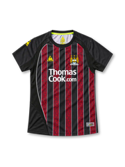 Manchester City 2008/09 black away jersey with marbled red stripes, white Thomas Cook.com sponsor, yellow Le Coq Sportif logo and club crest.