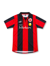 Eintracht Frankfurt 1999/00 home jersey with red and black stripes, lace-up collar, Puma logo, eagle crest and VIAG Interkom sponsor.