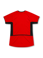 Manchester United 2002–04 red home short-sleeve jersey with black side panels, white Nike Swoosh, club crest and Vodafone sponsor.