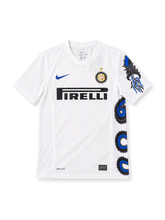 Inter Milan 2010/11 white away jersey with blue-and-black Biscione serpent graphic, blue Nike Swoosh, Pirelli sponsor and gold-star club crest.