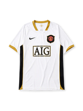 Manchester United 2006-07 away jersey in white with gold and black panels