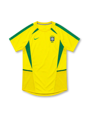 Brazil 2002 yellow home jersey by Nike with green shoulder stripes, curved green side panels, green Nike Swoosh and four-star CBF crest.