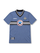 Newcastle United 1995/96 sky-blue away jersey with black-and-white chest stripes, white adidas logo, club crest and Newcastle Brown Ale sponsor.