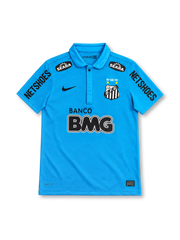 Santos FC 2012 turquoise-blue third jersey with Nike Swoosh, 1912–2012 centenary crest, Banco BMG sponsor, Seara patches and Netshoes sleeve branding.