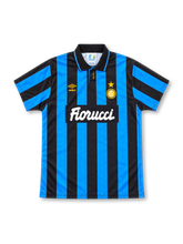 Inter Milan 1992/94 home jersey with blue-and-black vertical stripes, black polo collar, yellow Umbro logo, gold-star crest and white Fiorucci sponsor.