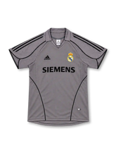 Real Madrid 2005/06 silver-gray third jersey with black adidas shoulder stripes, curved black piping, fold-down collar, Siemens sponsor and club crest.