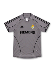 Real Madrid 2005/06 silver-gray third jersey with black adidas shoulder stripes, curved black piping, fold-down collar, Siemens sponsor and club crest.