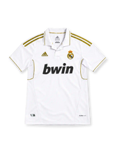 Real Madrid 2011/12 white home jersey with metallic-gold adidas shoulder stripes, white polo collar, crowned club crest, black bwin sponsor and CLIMACOOL branding.