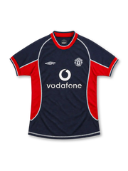 Manchester United 2000/01 navy third jersey with red side panels, white Umbro logo, monochrome club crest, white Vodafone sponsor and contrasting seams.