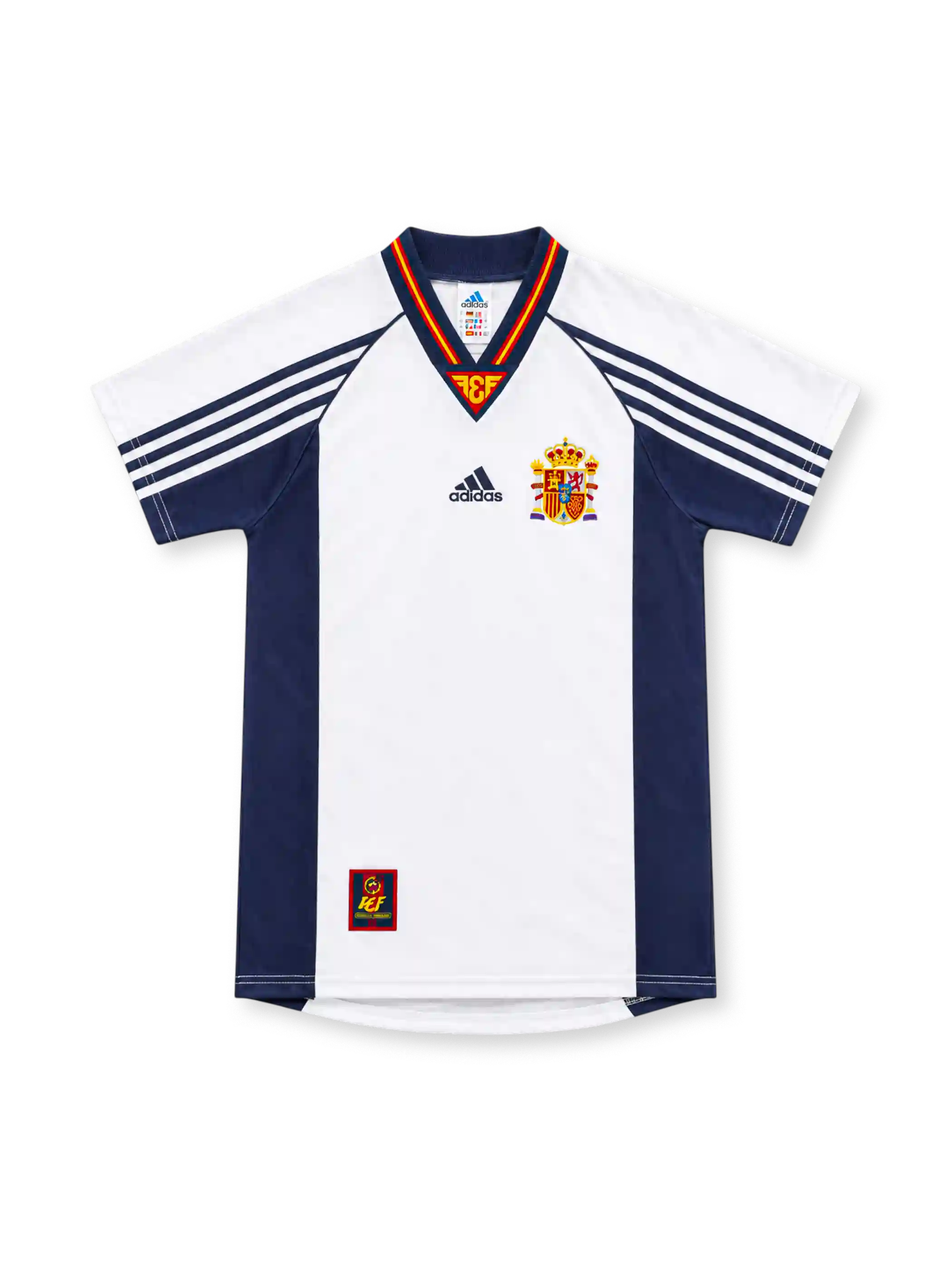 Spain 1998 white away jersey with navy side panels, adidas three-stripe sleeves, red-and-yellow V-neck trim, Spanish federation crest and lower-hem emblem.