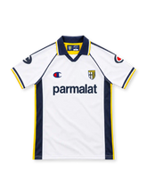 Parma 2003/04 white away jersey with navy side panels, yellow piping, Champion logos, Parmalat chest sponsor, Parma crest and navy polo collar.