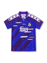 Real Madrid 1994/96 purple away jersey with blue diagonal stripes, white Kelme paw-print shoulder bands, club crest, white Teka sponsor and purple polo collar.