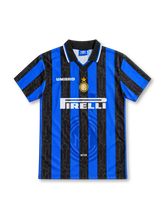 Inter Milan 1997/98 home jersey with blue-and-black vertical stripes, subtle script patterns, white Umbro logo, central gold-star Inter crest, Pirelli sponsor and black polo collar.