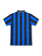 Inter Milan 1997/98 home jersey with blue-and-black vertical stripes, subtle script patterns, white Umbro logo, central gold-star Inter crest, Pirelli sponsor and black polo collar.