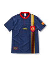 Spain 1996 navy away jersey featuring subtle vertical jacquard stripes, a red button collar, red-and-yellow vertical chest stripes, Spanish federation crest, gold adidas wordmark and sleeve flag.