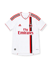 AC Milan 2011/12 white away jersey featuring asymmetric red-and-black vertical stripes, red V-neck trim, adidas shoulder stripes, club crest with gold star, red Fly Emirates sponsor and ClimaCool branding.