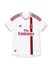 AC Milan 2011/12 white away jersey featuring asymmetric red-and-black vertical stripes, red V-neck trim, adidas shoulder stripes, club crest with gold star, red Fly Emirates sponsor and ClimaCool branding.
