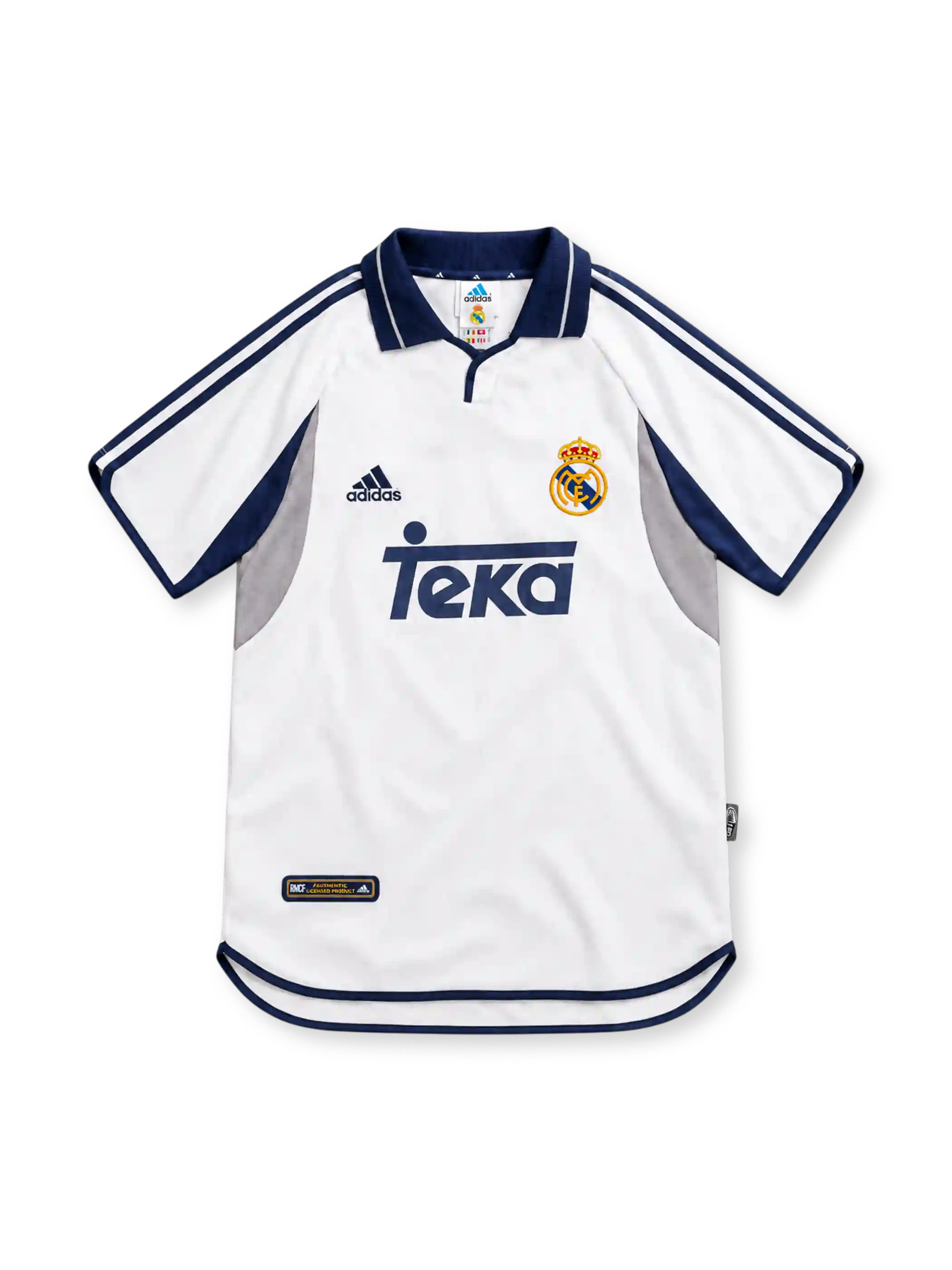 Real Madrid 2000/01 white adidas home jersey featuring navy polo collar, navy shoulder stripes, grey and navy curved side panels, crowned club crest, navy Teka sponsor and curved hem.