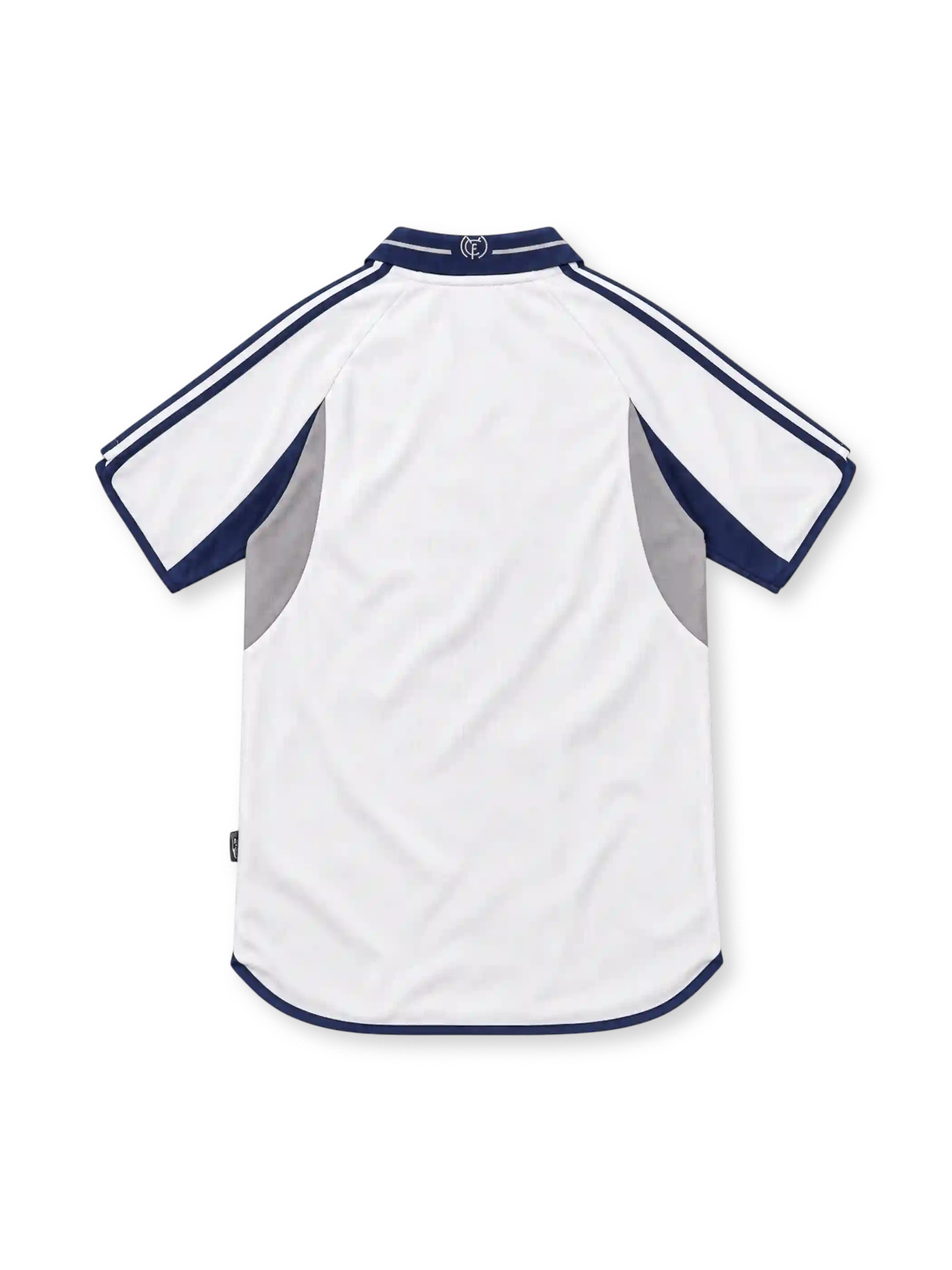 Real Madrid 2000/01 white adidas home jersey featuring navy polo collar, navy shoulder stripes, grey and navy curved side panels, crowned club crest, navy Teka sponsor and curved hem.