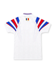 France 1996 white adidas away jersey featuring sweeping blue and red shoulder stripes, tricolor-trimmed V-neck collar, central blue adidas wordmark, gold French Football Federation rooster emblem, and heritage hem patch.