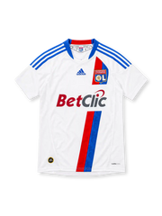Olympique Lyonnais 2010/11 white adidas home jersey with blue shoulder stripes, red and blue diagonal accents, OL crest, Betclic sponsor, commemorative 1950–2010 neckline detail, and ClimaCool branding.