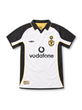 Manchester United 2001/02 centenary away jersey by Umbro in white and black with gold piping, a black polo collar, special centenary crest, black Vodafone sponsor, and commemorative hem label.