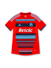 Olympique Marseille 2011/12 adidas third jersey featuring a red body, sky-blue and navy horizontal stripes, light-blue shoulder stripes, OM crest, white Betclic sponsor, navy sleeve cuffs, and ClimaCool branding.