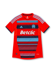 Olympique Marseille 2011/12 adidas third jersey featuring a red body, sky-blue and navy horizontal stripes, light-blue shoulder stripes, OM crest, white Betclic sponsor, navy sleeve cuffs, and ClimaCool branding.