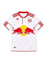 New York Red Bulls 2010 white adidas home jersey with red shoulder stripes, red-trimmed button collar, club crest, large red bulls and yellow sun sponsor graphic, red sleeve detailing, and ClimaCool branding.
