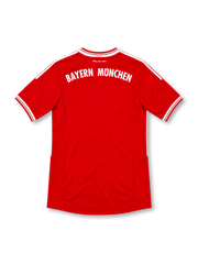 Bayern Munich 2013/14 Bundesliga home jersey by adidas in red with subtle diamond graphics, white shoulder stripes, white-trimmed V-neck and sleeve cuffs, four-star club crest, Deutsche Telekom sponsor, and ClimaCool branding.