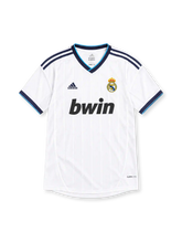 Real Madrid 2012/13 white adidas home jersey with subtle vertical pinstripes, navy shoulder stripes, navy and turquoise V-neck collar, crowned club crest, black bwin sponsor, and ClimaCool branding.