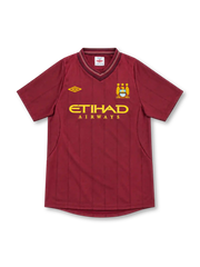 Manchester City 2012/13 Umbro away jersey in deep maroon with tonal vertical pinstripes, layered V-neck collar, gold Umbro logo, three-star club crest, and gold Etihad Airways sponsor.