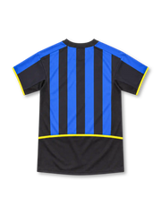 Inter Milan 2002/03 Nike home jersey featuring blue-and-black vertical stripes, black V-neck collar, yellow Nike logo, Inter crest with gold star, white Pirelli sponsor, and yellow sleeve and side accents.