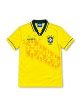 Brazil 1994/96 yellow home jersey with green collar, tonal crest pattern, Umbro logo and four-star CBF crest