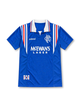 Rangers 1996/97 royal blue home jersey with white collar, red and white stripes, adidas logo and McEwan's Lager sponsor