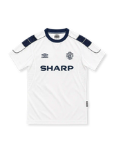 Manchester United 1999/00 white away jersey with navy shoulder panels, Umbro logo and Sharp sponsor