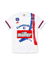 Paris Saint-Germain 1991/92 white jersey with blue and red Eiffel Tower brushstrokes, Nike logo, Commodore and Müller sponsors