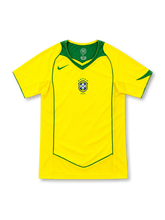Brazil 2004 yellow home jersey with green yoke, green piping, Nike logo and five-star CBF crest