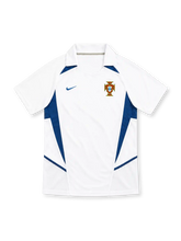 Portugal 2002 white away jersey with blue angular panels, polo collar, Nike logo and federation crest