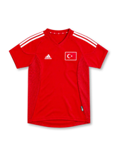 Turkey 2002 red home jersey with white adidas stripes, red mesh side panels and flag emblem