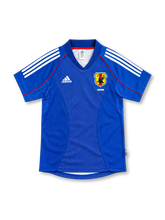 Japan 2002 royal blue home jersey with white adidas stripes, red piping and JFA crest