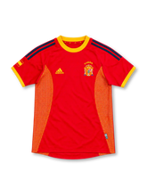Spain 2002 red home jersey with yellow collar, navy adidas stripes, gold mesh side panels and embroidered crest