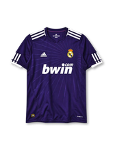 Real Madrid 2010/11 purple Adidas third jersey with sunburst pattern and bwin.com sponsor