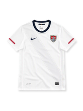 USA 2010 white home jersey with tonal diagonal sash, navy collar, red sleeve stripes and US Soccer crest