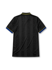 Manchester United 1993-94 away jersey, front view, black body with tonal diamond jacquard pattern, gold and blue striped collar, Umbro diamond logo, club crest, SHARP Viewcam sponsor logo, gold and blue diamond cuffs